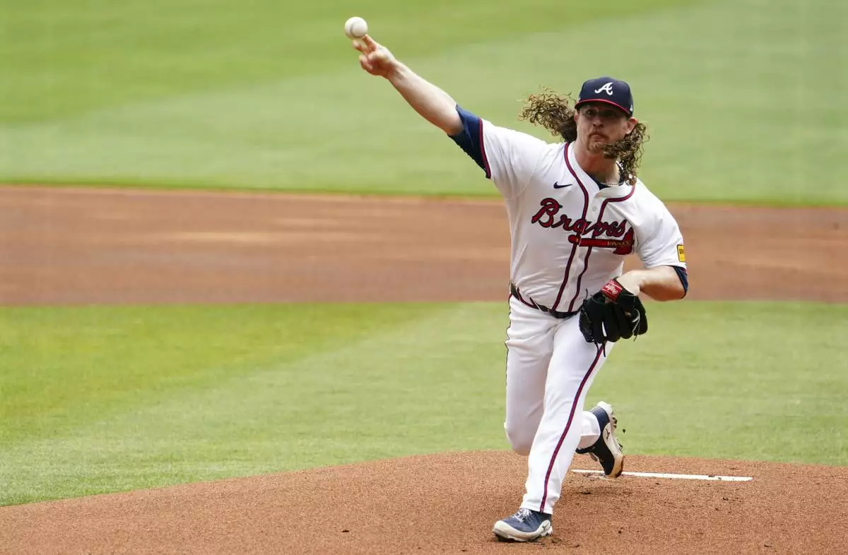 Atlanta Braves pitcher Grant Holmes (66) delivers a pitch against the Minnesota Twins during the first inning of a baseball game Saturday, April 20, 2025, in Atlanta. (AP Photo/John David Mercer)