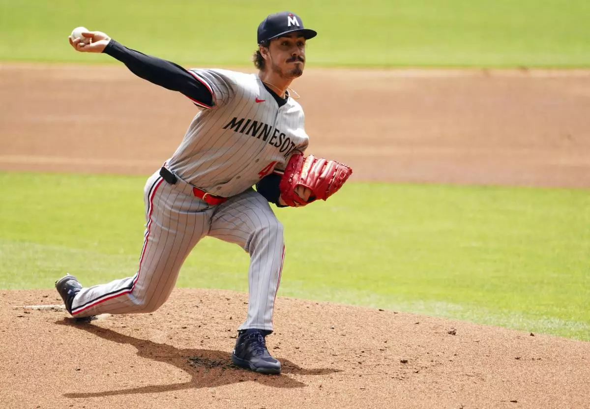 Minnesota Twins pitcher Joe Ryan (41) delivers a pitch against the Atlanta Braves during the first inning of a baseball game Saturday, April 20, 2025, in Atlanta. (AP Photo/John David Mercer)