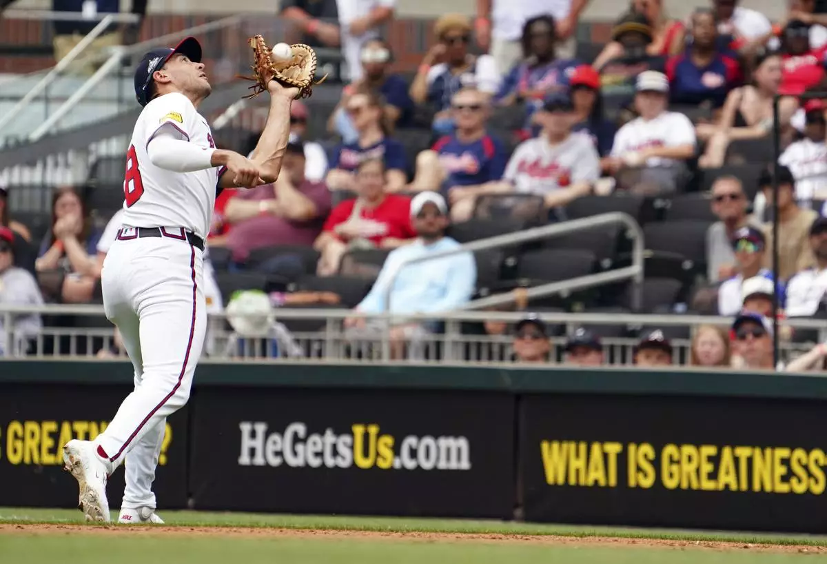 Atlanta Braves' Matt Olson (28) catches a ball for an out against the Minnesota Twins during the fourth inning of a baseball game Saturday, April 20, 2025, in Atlanta. (AP Photo/John David Mercer)