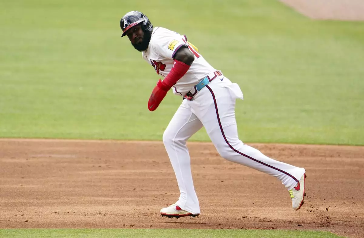 Atlanta Braves designated hitter Marcell Ozuna (20) runs the bases against the Minnesota Twins during the first inning of a baseball game Saturday, April 20, 2025, in Atlanta. (AP Photo/John David Mercer)