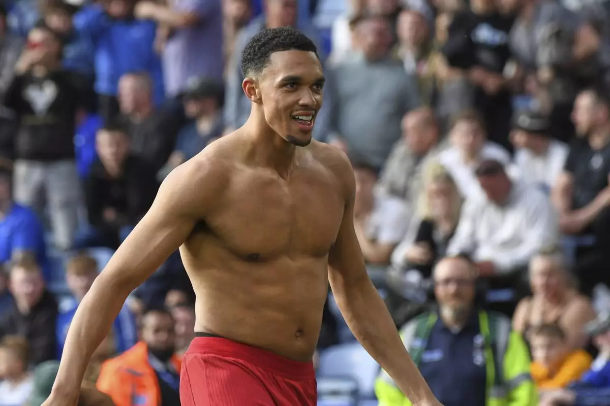 Liverpool's Trent Alexander-Arnold celebrates after scoring his side's opening goal during the English Premier League soccer match between Leicester City and Liverpool at King Power stadium in Leicester, England, Sunday, April 20, 2025. (AP Photo/Rui Vieira)