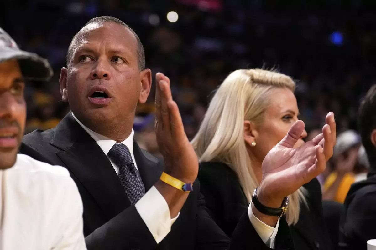 Alex Rodriguez, co-owner, of the Minnesota Timberwolves, claps during the second half in Game 1 of an NBA first-round playoff series Los Angeles Lakers, Saturday, April 19, 2025, in Los Angeles. (AP Photo/Mark J. Terrill)