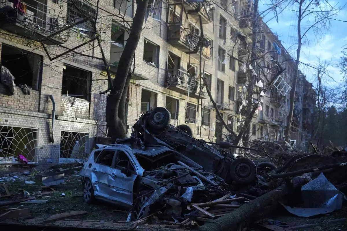 Damaged cars lie in a yard with other debris after a Russian ballistic missile attack in Kyiv, Ukraine, Thursday, April 24, 2025. (AP Photo/Efrem Lukatsky)