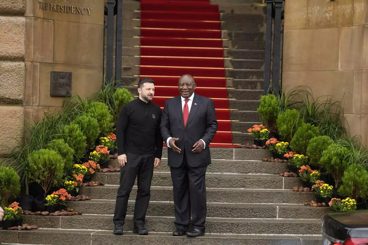 South Africa's President Cyril Ramaphosa greets Ukrainian President Volodymyr Zelenskyy, at the Union Buildings in Pretoria, South Africa, Thursday, April 24, 2025. (AP Photo/Themba Hadebe)
