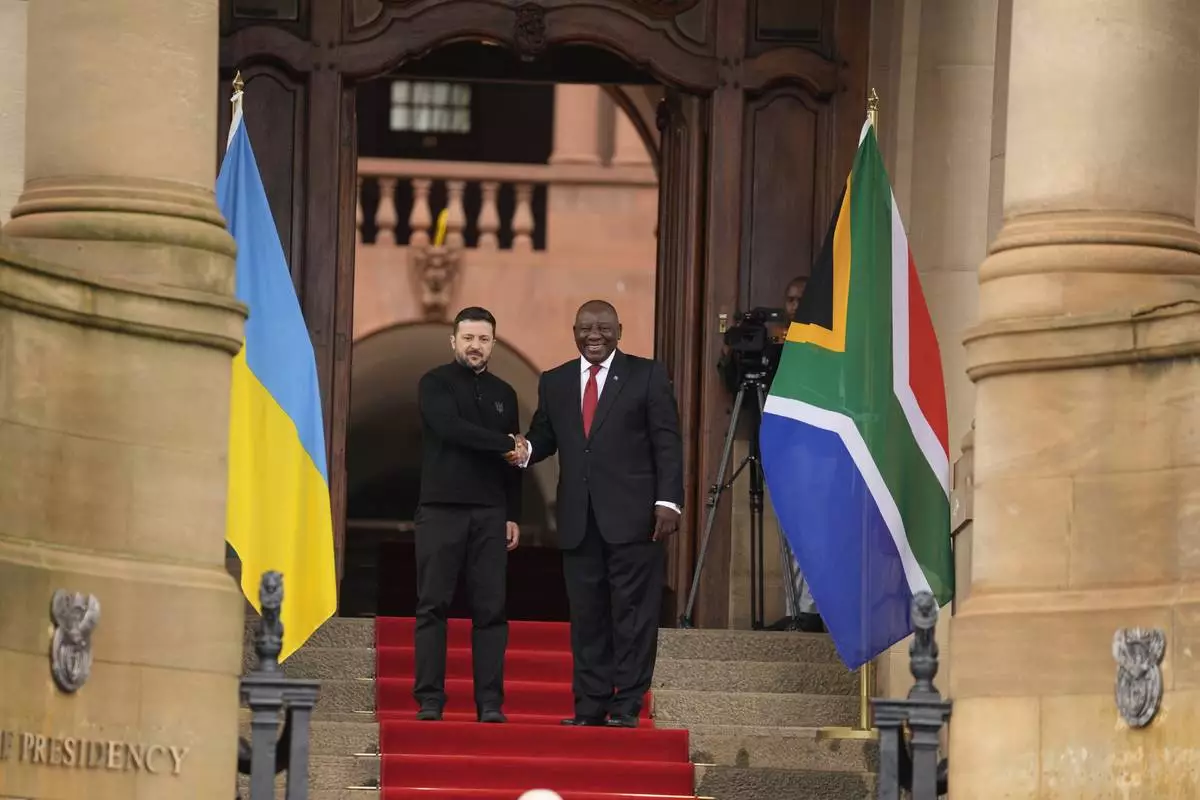 South Africa's President Cyril Ramaphosa, right, shakes hands with Ukrainian President Volodymyr Zelenskyy, at the Union Buildings in Pretoria, South Africa, Thursday, April 24, 2025. (AP Photo/Themba Hadebe)
