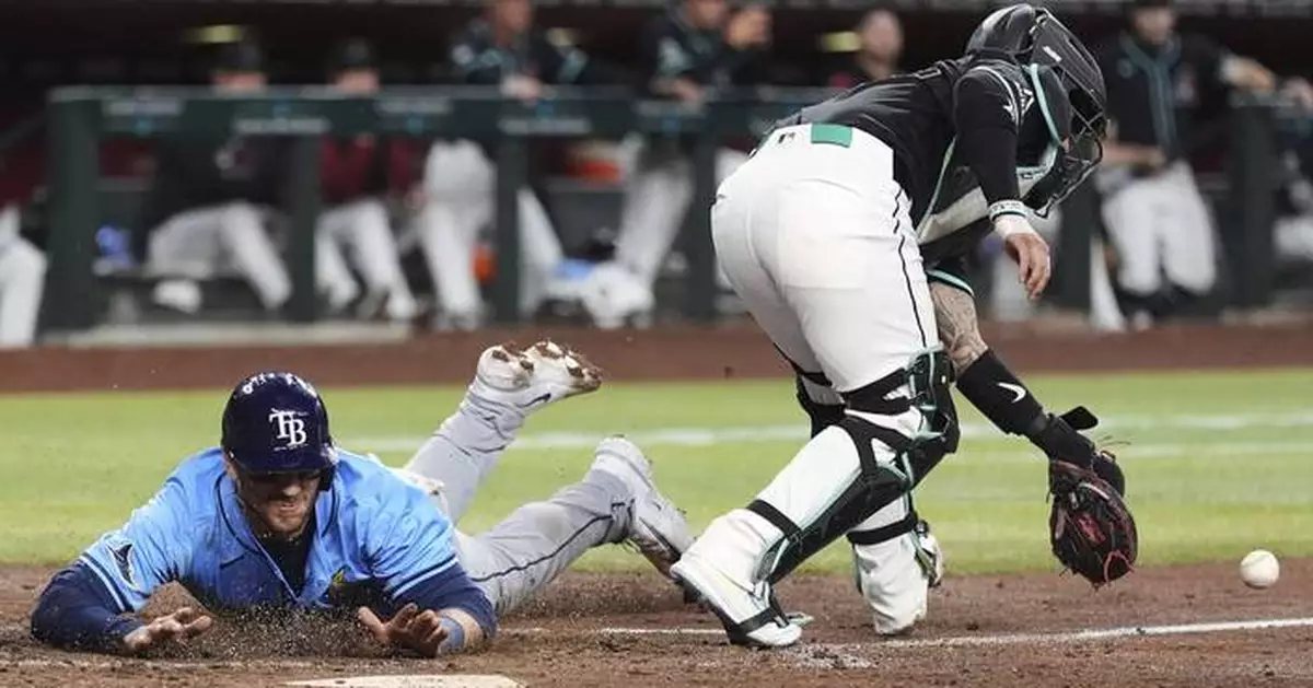 Rays outlast Diamondbacks 7-6 in 11 innings, overcoming Carroll's 2 HRs