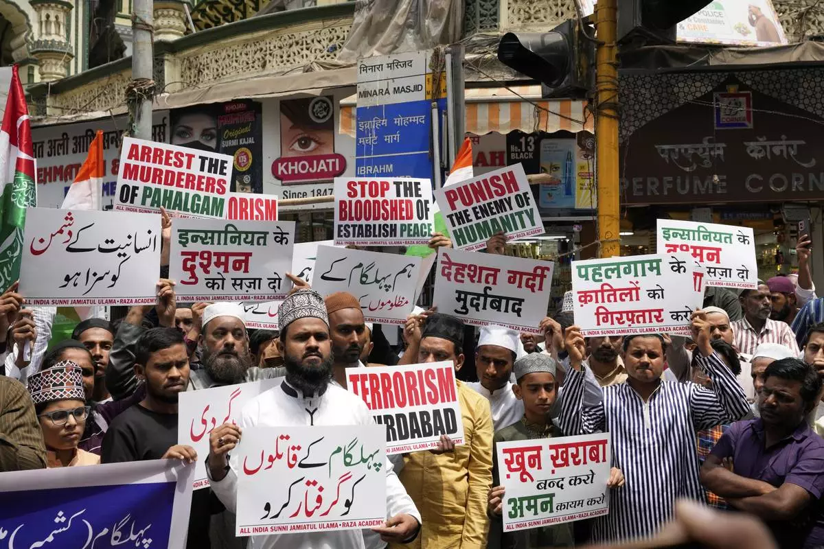 Muslims shout slogans after Friday prayers during a protest organized by Raza Academy against the killing of tourists by militants near Pahalgam in Indian controlled Kashmir in Mumbai, India, Friday, April. 25, 2025.(AP Photo/Rajanish Kakade)