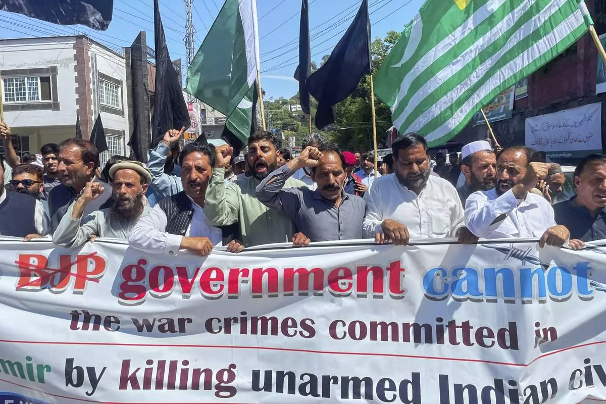 Members of Kashmiri refugee organization "Pasban-e-Hurriya" chant slogans during a demonstration to denounce the suspension of the water sharing treaty by India, in Muzaffarabad, the capital of Pakistan-administered Kashmir, Friday, April 25, 2025. (AP Photo/M.D. Mughal)