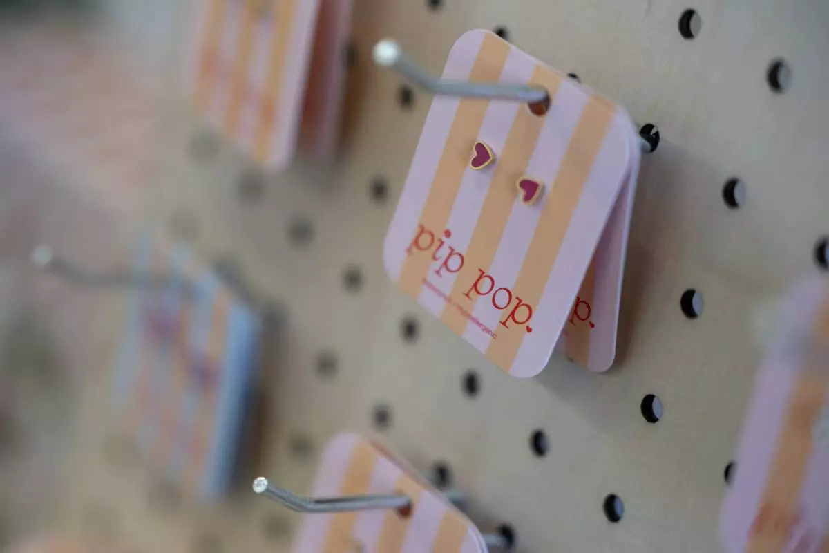 Earrings manufactured in China are displayed for sale at the baby store Three Littles' Union Market location in Washington, on Wednesday, April 16, 2025. (AP Photo/Nathan Howard)