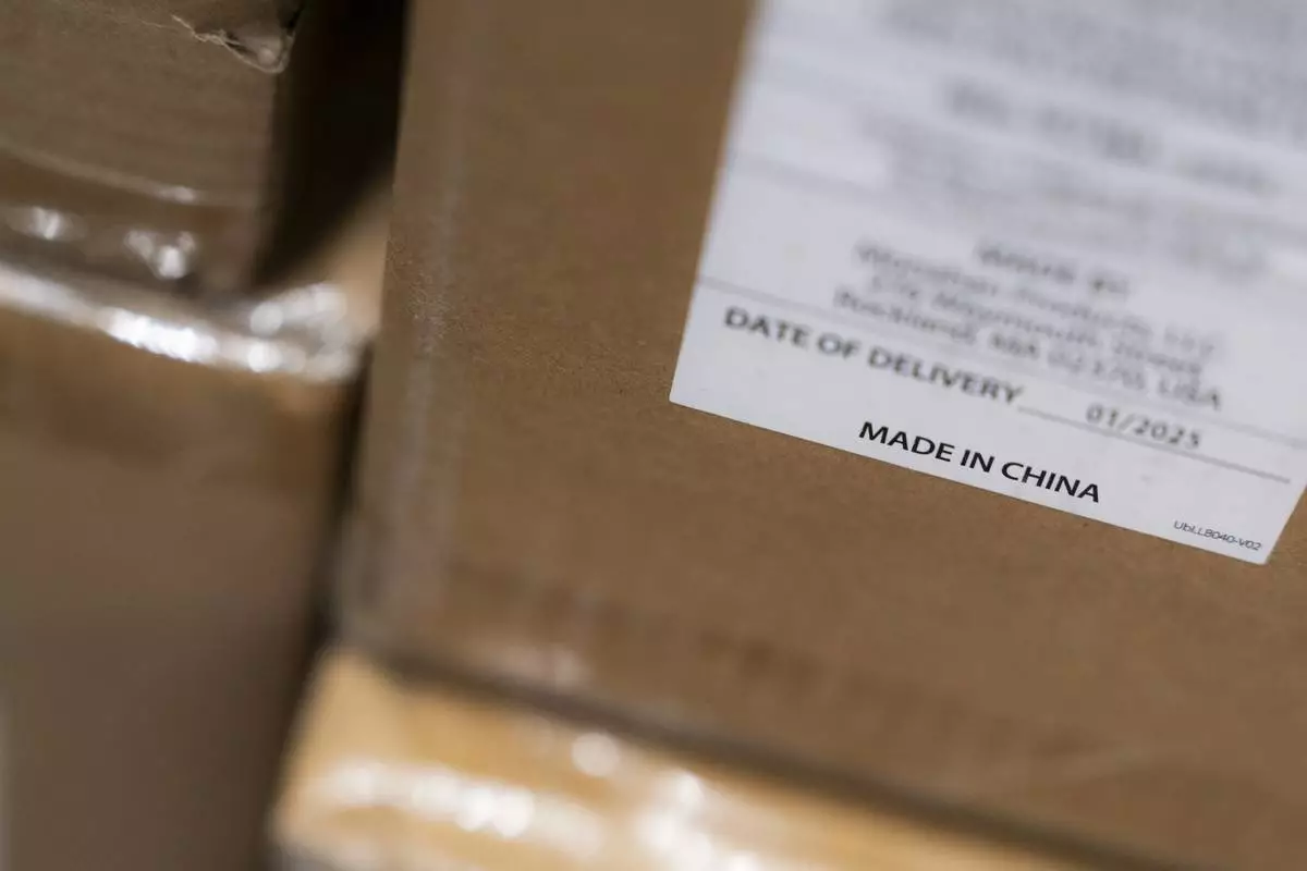 A "Made in China" sticker is seen on inventory at the baby store Three Littles Union Market location in Washington, on Wednesday, April 16, 2025. (AP Photo/Nathan Howard)