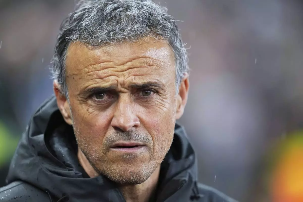 PSG's head coach Luis Enrique waits for the start of the Champions League quarterfinal second leg soccer match between Aston Villa and Paris Saint-Germain at Villa Park stadium, Birmingham, England, Tuesday, April 15, 2025. (AP Photo/Kirsty Wigglesworth)