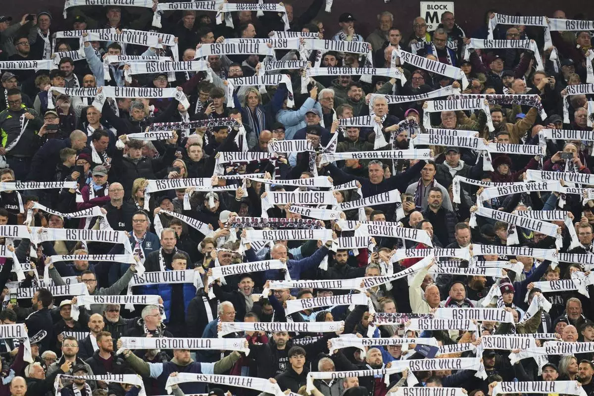 Aston Villa fans cheer ahead of the Champions League quarterfinal second leg soccer match between Aston Villa and Paris Saint-Germain at Villa Park stadium, Birmingham, England, Tuesday, April 15, 2025. (AP Photo/Kirsty Wigglesworth)
