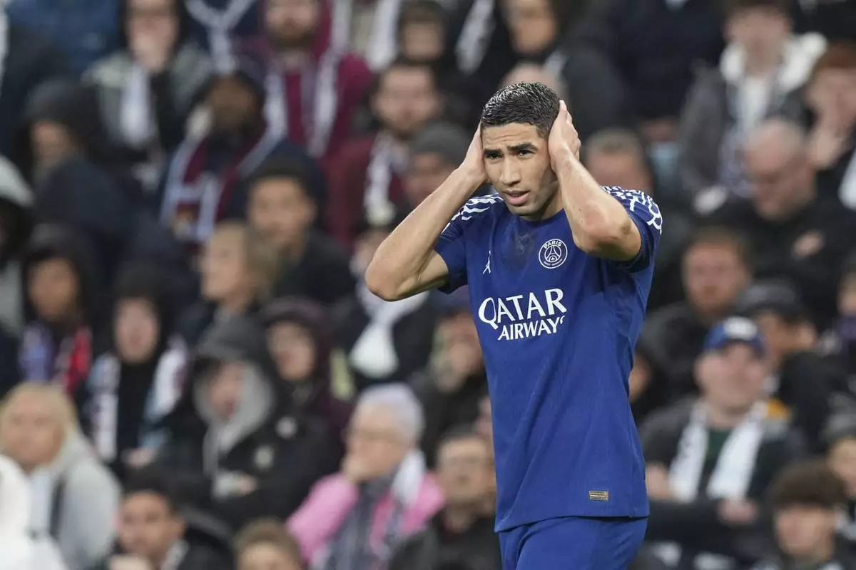 PSG's Achraf Hakimi celebrates after scoring his side's first goal during the Champions League quarterfinal second leg soccer match between Aston Villa and Paris Saint-Germain at the Villa Park stadium, in Birmingham, England, Tuesday, April 15, 2025. (AP Photo/Frank Augstein)