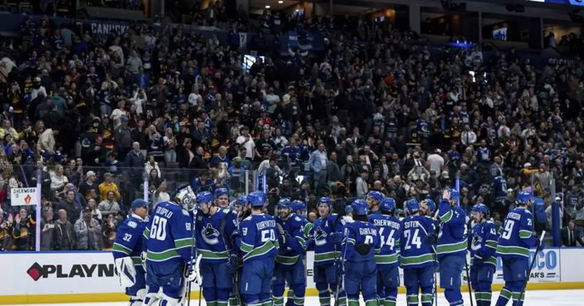 DeBrusk scores late in OT to give Canucks 2-1 win over Sharks