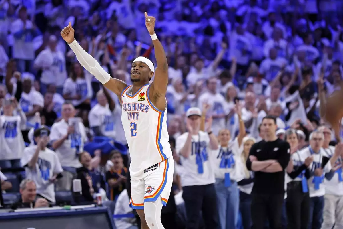 Oklahoma City Thunder guard Shai Gilgeous-Alexander reacts after making a basket during the first half in Game 1 of an NBA first-round playoff series against the Memphis Grizzlies, Sunday, April 20, 2025, in Oklahoma City. (AP Photo/Nate Billings)