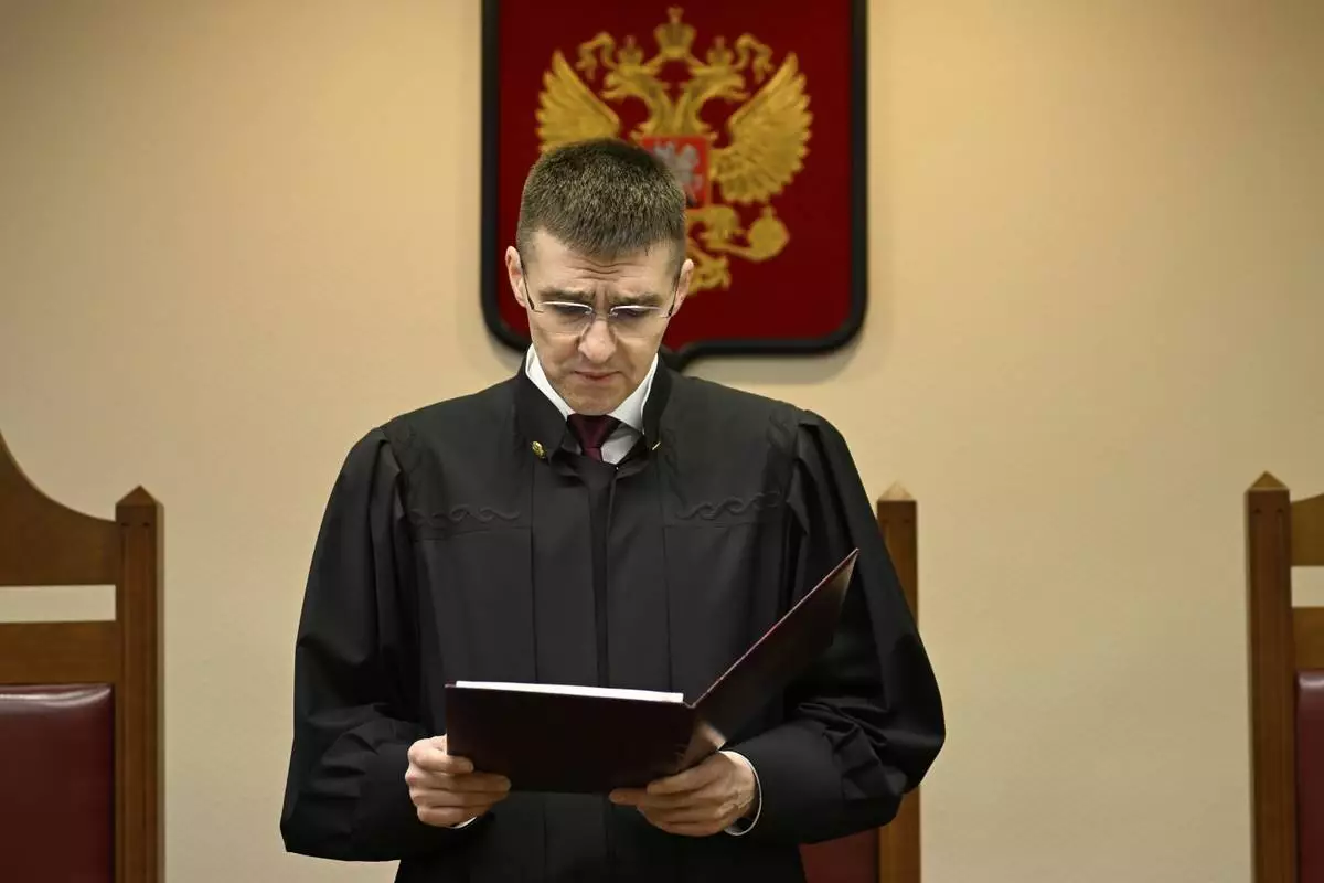Russia's Supreme Court judge Oleg Nefyodov delivers a verdict lifting a ban on Afghanistan's Taliban, who were designated as a terrorist group more than two decades ago, in Moscow, Russia, Thursday, April 17, 2025. (AP Photo/Dmitry Serebryakov)