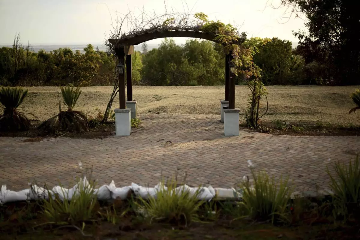 An empty lot sits alone along Cerro Crest Drive after the Mountain Fire burned through the area Wednesday, April 16, 2025, in Camarillo, Calif. (AP Photo/Wally Skalij)