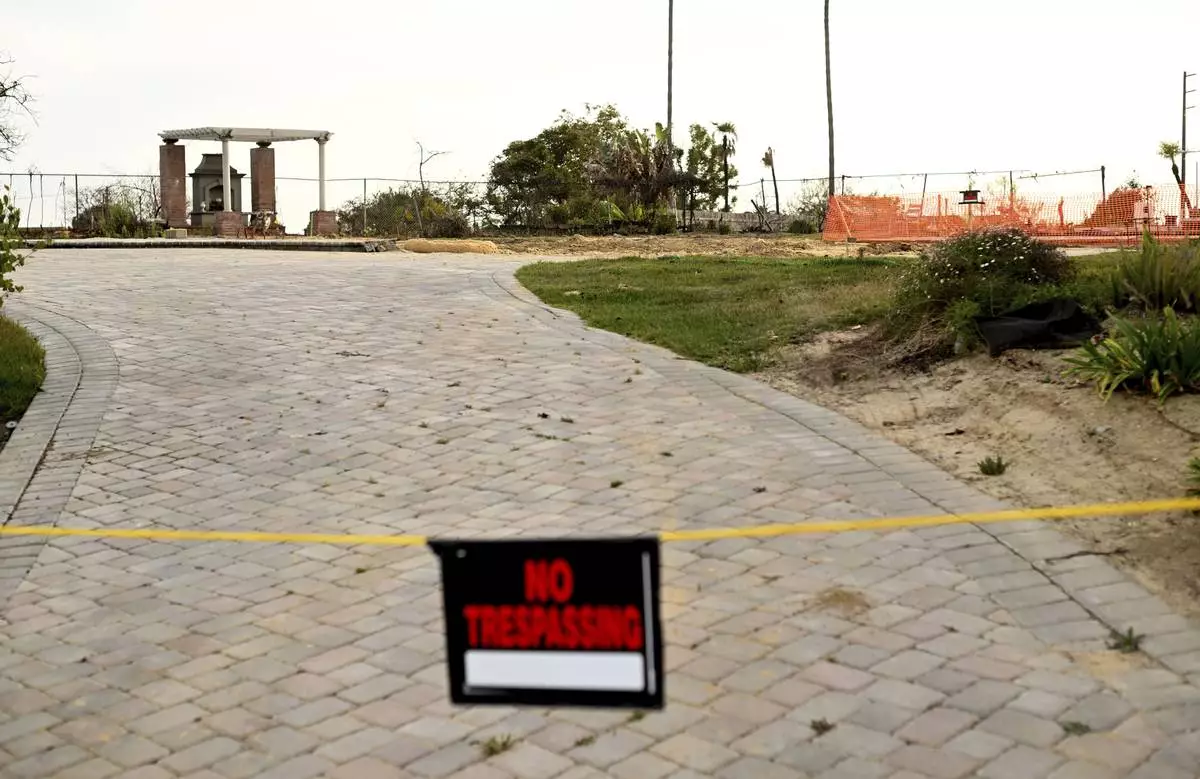 An empty lot sits alone along Old Coach Drive after the Mountain Fire burned through the area Wednesday, April 16, 2025, in Camarillo, Calif. (AP Photo/Wally Skalij)
