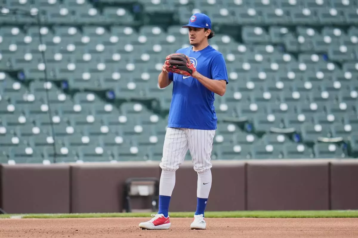 Chicago Cubs' Nicky Lopez warms up before a baseball game against the Los Angeles Dodgers, Wednesday, April 23, 2025, in Chicago. (AP Photo/Erin Hooley)