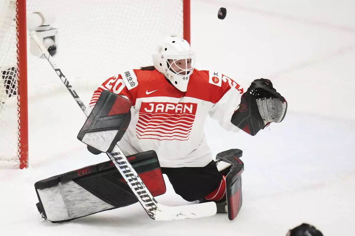 Japan's Miyuu Masuhara fails to make a save during the quarterfinal match between Canada and Japan at the Women's Ice Hockey Championships in Ceske Budejovice, Czech Republic, Thursday, April 17, 2025. (AP Photo/Petr David Josek)