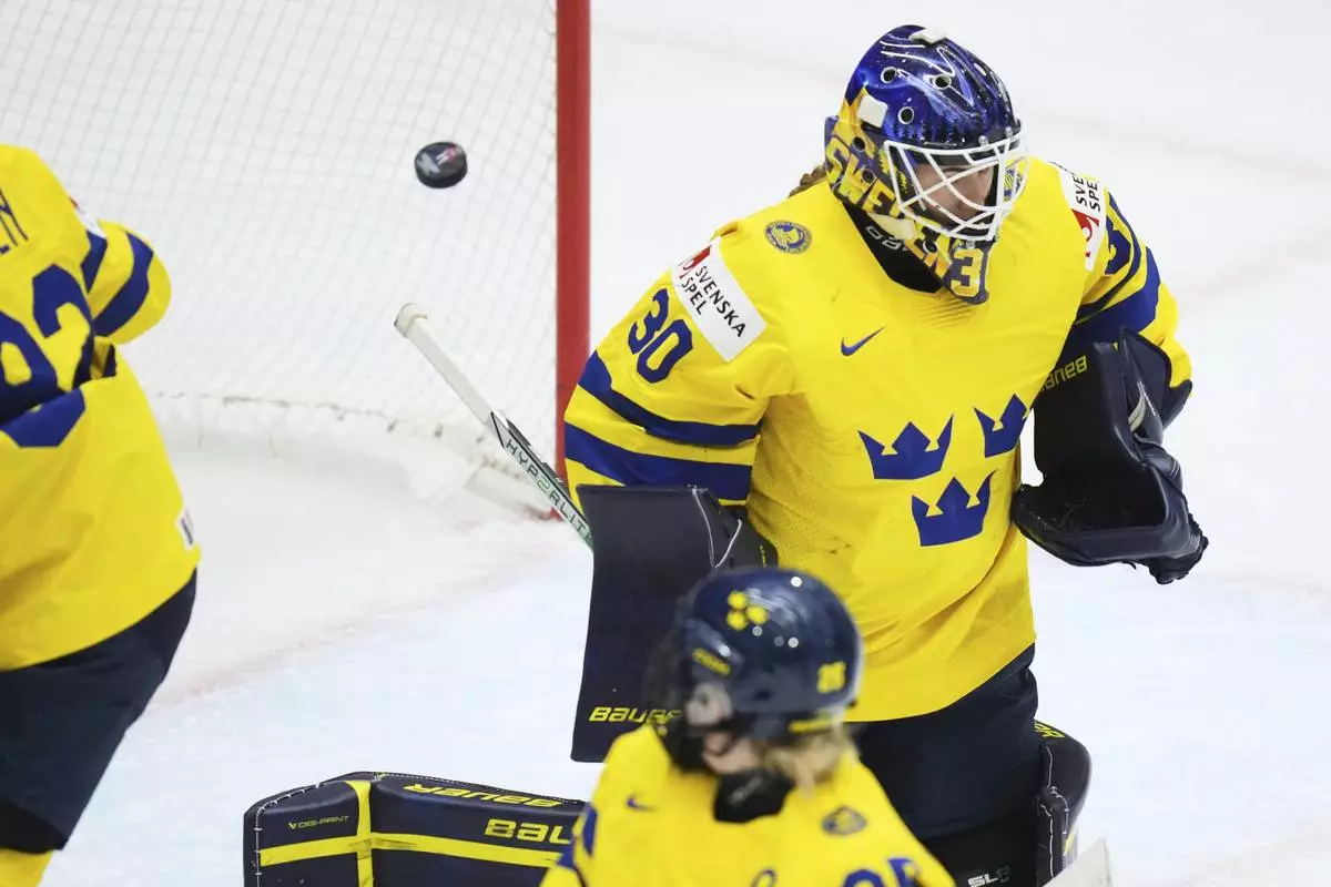 Sweden's Emma Soderberg fails to make a save during the quarterfinal match between Finland and Sweden at the Women's Ice Hockey Championships in Ceske Budejovice, Czech Republic, Thursday, April 17, 2025. (AP Photo/Petr David Josek)