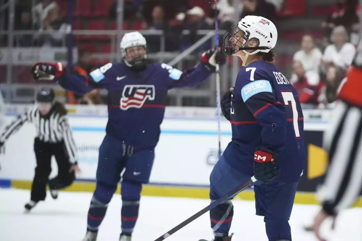 United States' Lacey Eden, right, celebrates after scoring her sides first goal during the quarterfinal match between United States and Germany at the Women's Ice Hockey Championships in Ceske Budejovice, Czech Republic, Thursday, April 17, 2025. (AP Photo/Petr David Josek)
