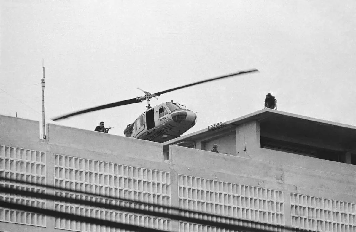 FILE- A U.S. Marine helicopter takes off from helipad on top of the American Embassy in Saigon, Vietnam, April 30, 1975. (AP Photo/Phu)