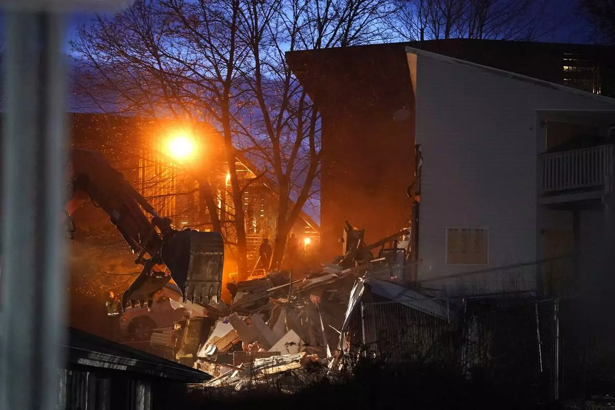 FILE- Heavy equipment is used to demolish the house where four University of Idaho students were killed in 2022 on Thursday, Dec. 28, 2023, in Moscow, Idaho. (AP Photo/Ted S. Warren, File)