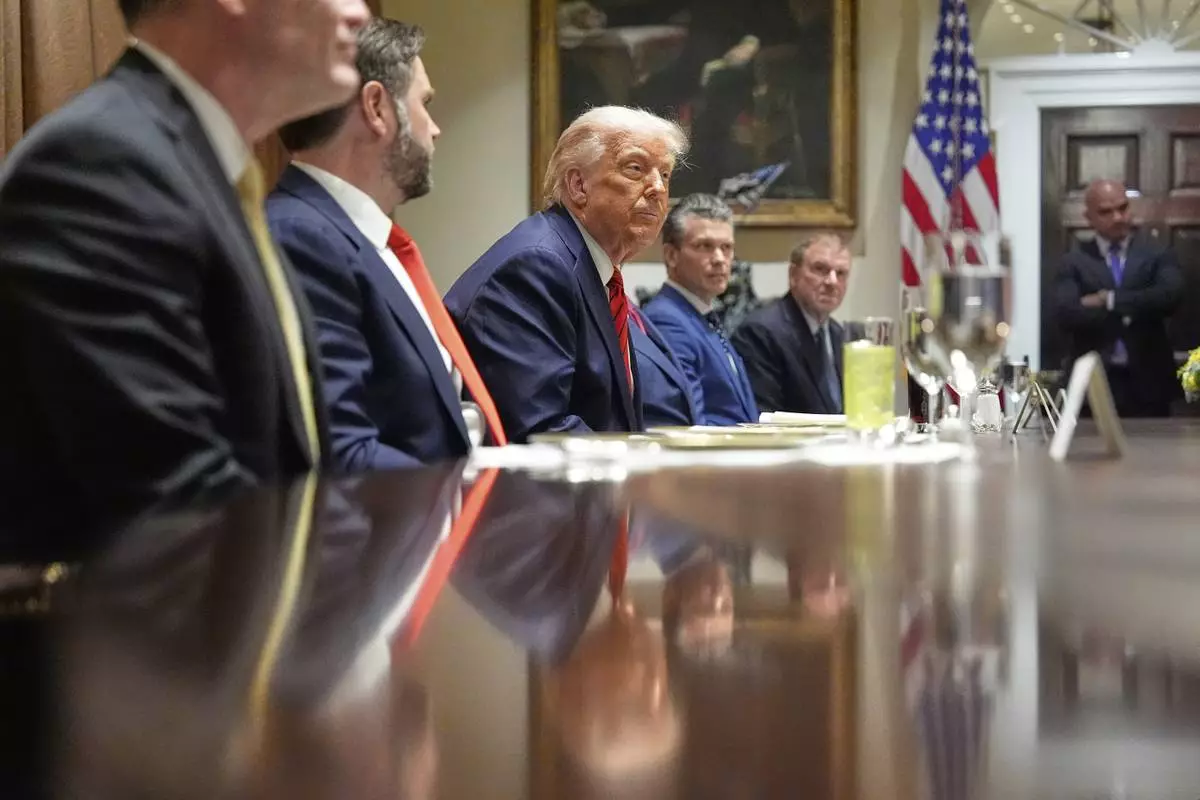 President Donald Trump listens before a luncheon with Italy's Prime Minister Giorgia Meloni in the Cabinet Room of the White House, Thursday, April 17, 2025, in Washington. (AP Photo/Alex Brandon)
