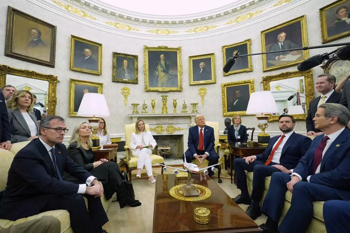 President Donald Trump meets with Italy's Prime Minister Giorgia Meloni in the Oval Office of the White House, Thursday, April 17, 2025, in Washington. (AP Photo/Alex Brandon)