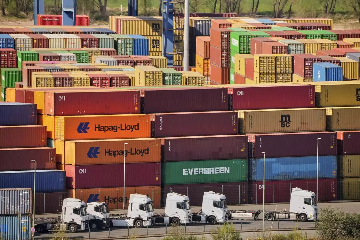 Containers are stored at a container terminal in Duisburg, Germany, the day after President Trump announced new tariffs for the EU and the rest of the world, Thursday, April 3, 2025. (AP Photo/Martin Meissner)