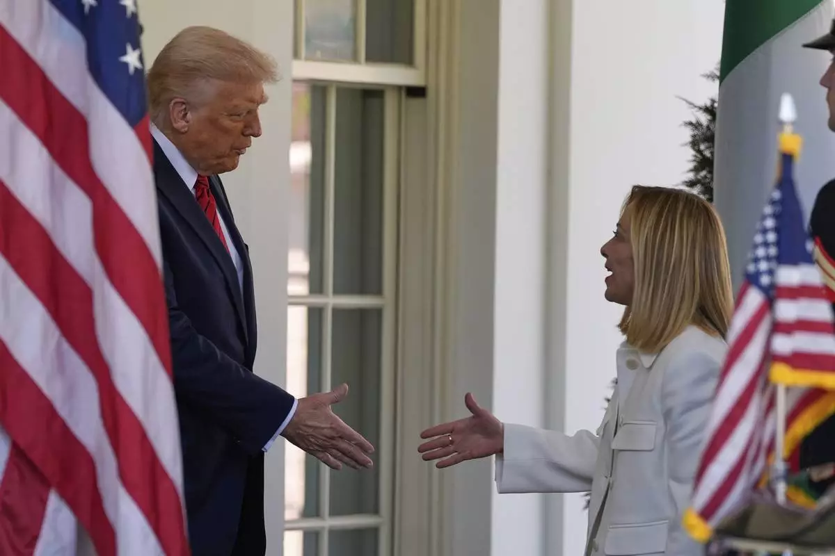 President Donald Trump greets Italy's Prime Minister Giorgia Meloni at the White House, Thursday, April 17, 2025, in Washington. (AP Photo/Alex Brandon)