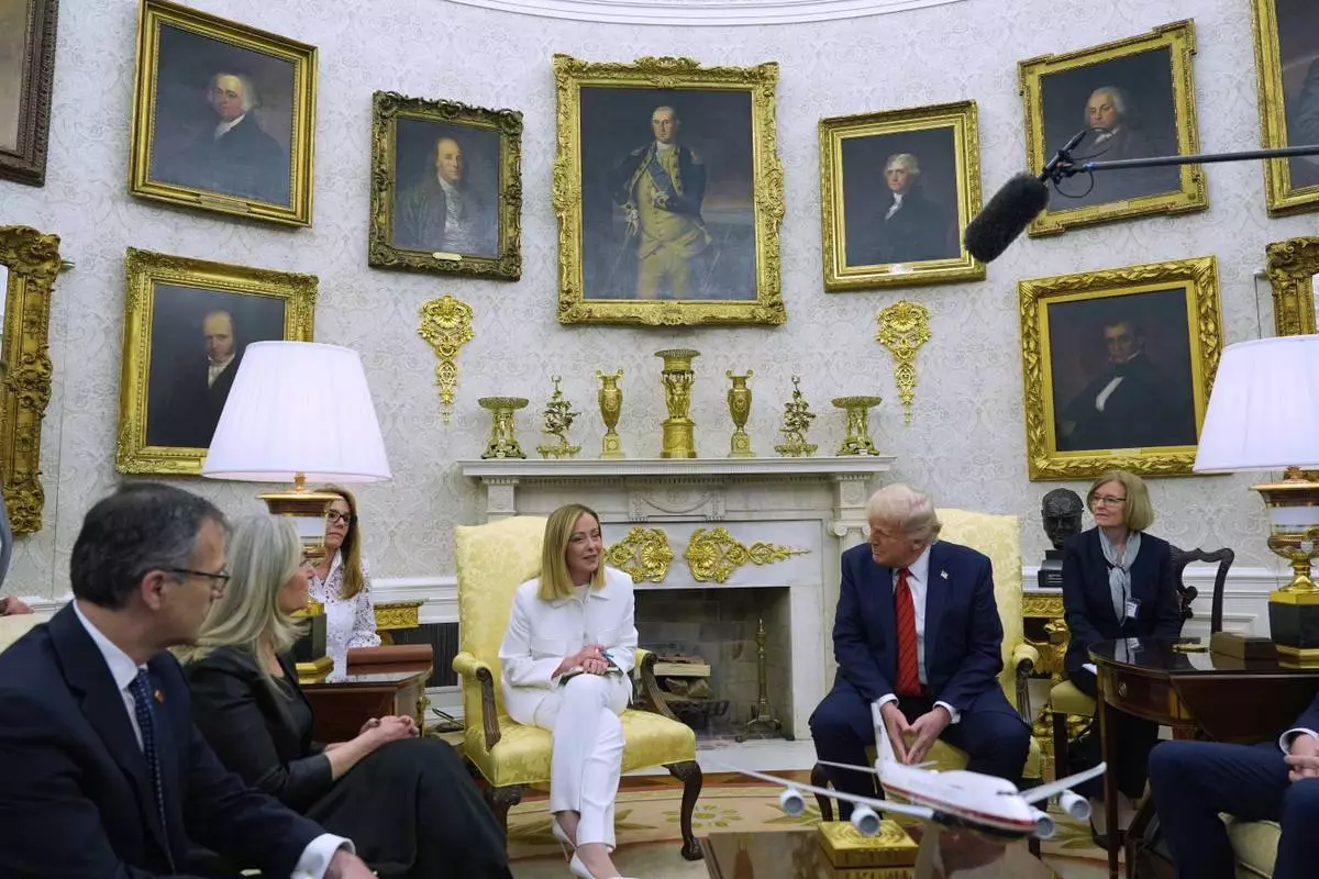 President Donald Trump meets with Italy's Prime Minister Giorgia Meloni in the Oval Office of the White House, Thursday, April 17, 2025, in Washington. (AP Photo/Alex Brandon)