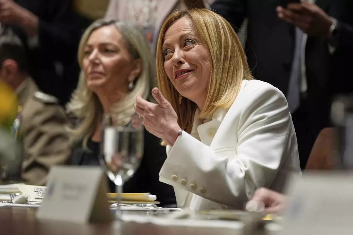 Italy's Prime Minister Giorgia Meloni speaks before a luncheon with President Donald Trump in the Cabinet Room of the White House, Thursday, April 17, 2025, in Washington. (AP Photo/Alex Brandon)