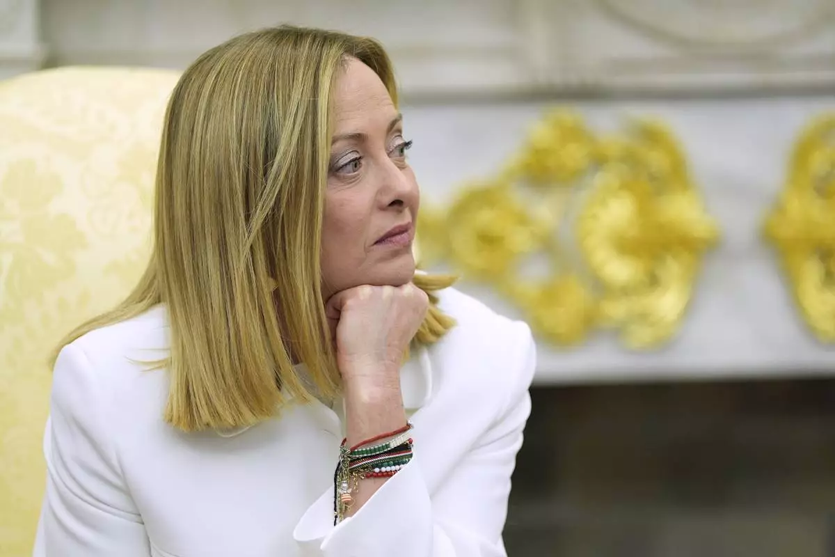 Italy's Prime Minister Giorgia Meloni listens as she meets with President Donald Trump in the Oval Office of the White House, Thursday, April 17, 2025, in Washington. (AP Photo/Alex Brandon)