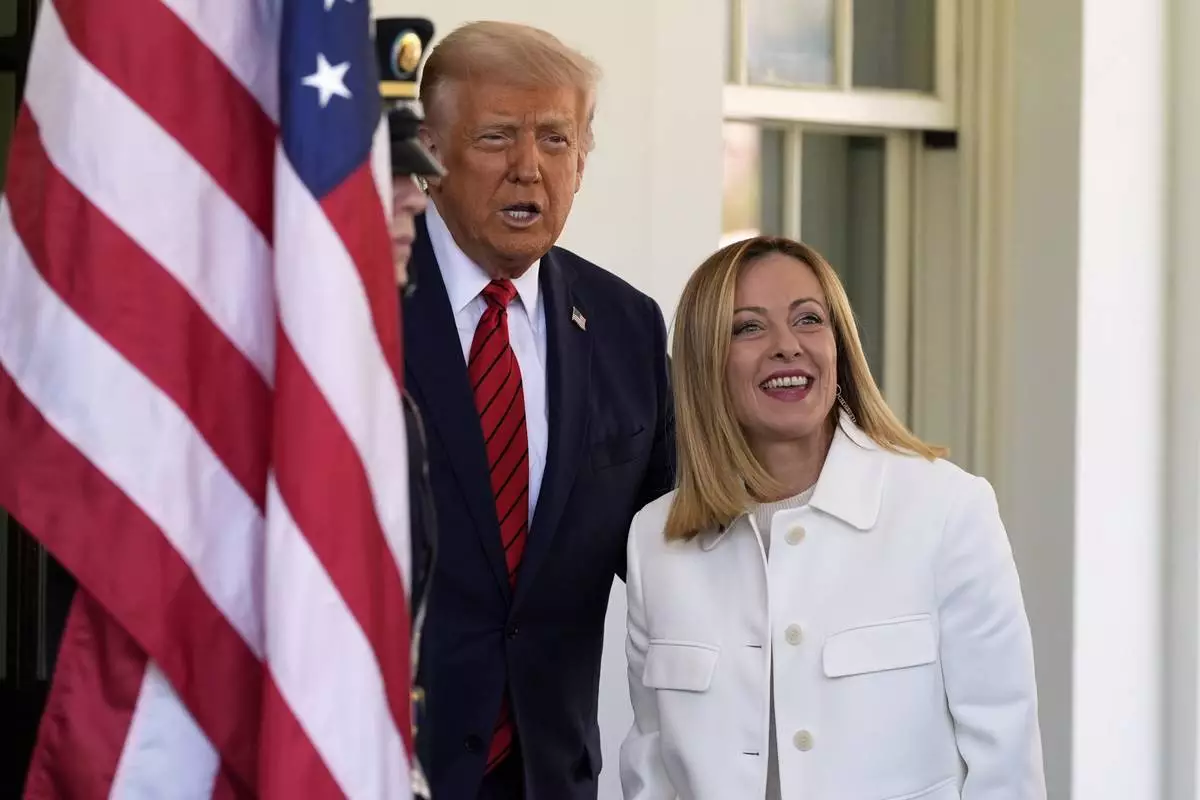 President Donald Trump greets Italy's Prime Minister Giorgia Meloni at the White House, Thursday, April 17, 2025, in Washington. (AP Photo/Alex Brandon)