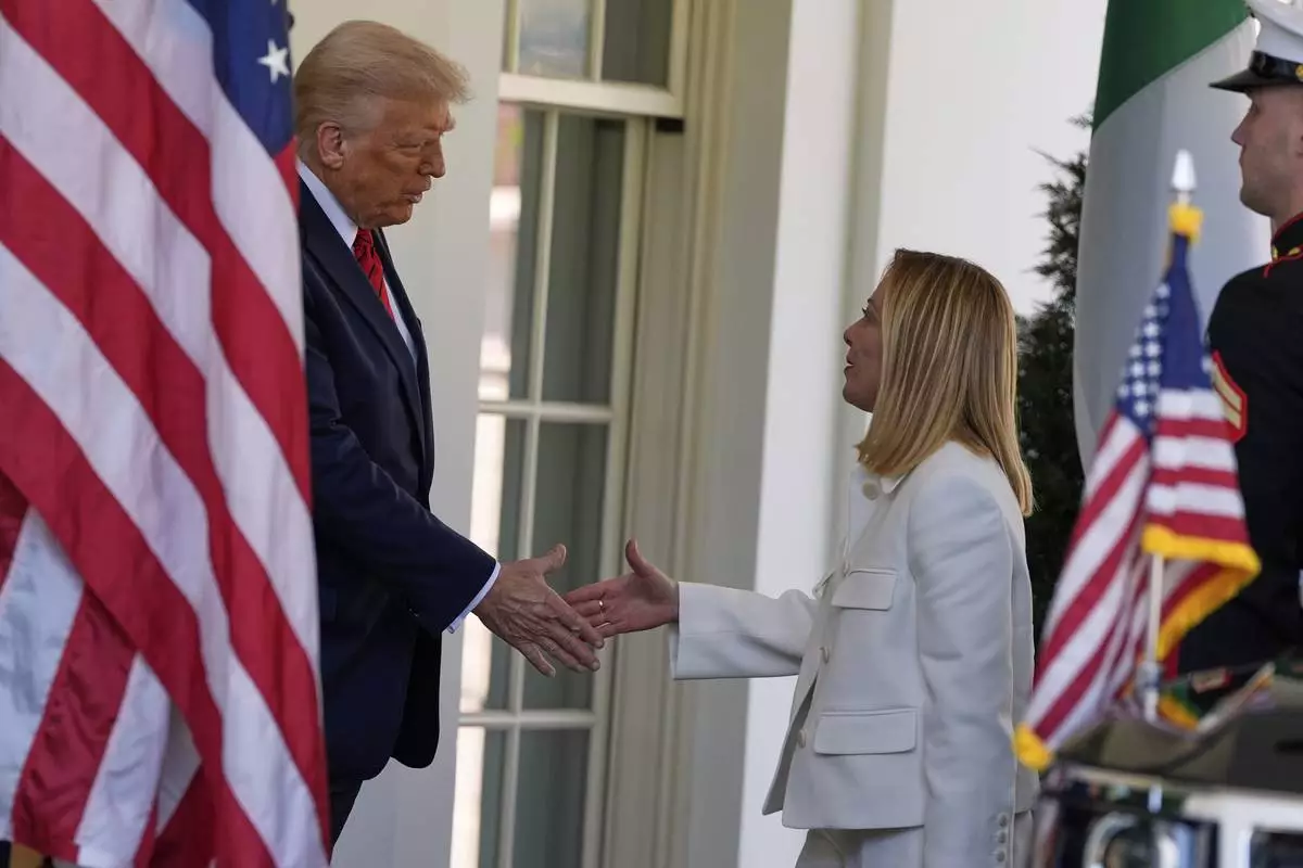 President Donald Trump greets Italy's Prime Minister Giorgia Meloni at the White House, Thursday, April 17, 2025, in Washington. (AP Photo/Alex Brandon)