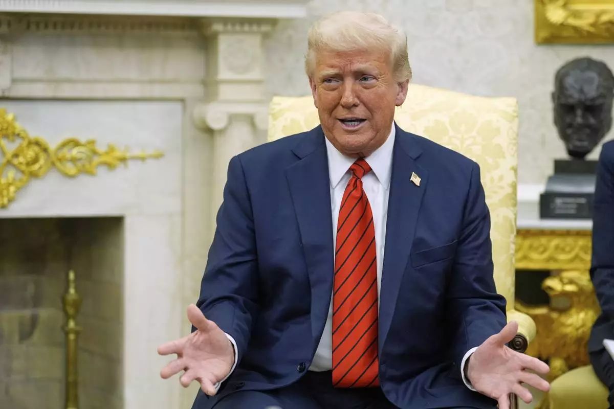 President Donald Trump speaks as he meets with Italy's Prime Minister Giorgia Meloni in the Oval Office of the White House, Thursday, April 17, 2025, in Washington. (AP Photo/Alex Brandon)
