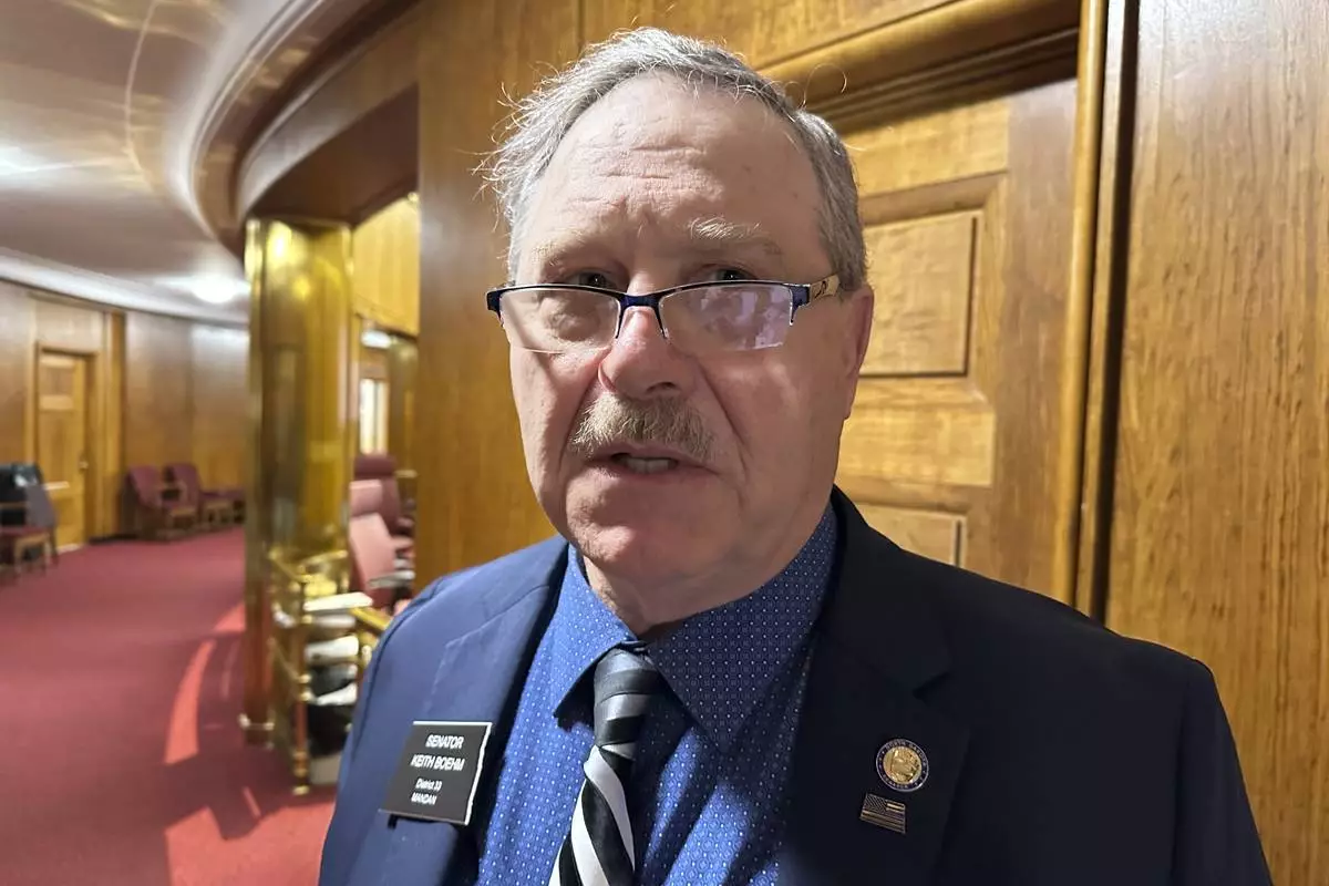 North Dakota Republican Sen. Keith Boehm visits on Tuesday, April 22, 2025, at the state Capitol in Bismarck, N.D. (AP Photo/Jack Dura)