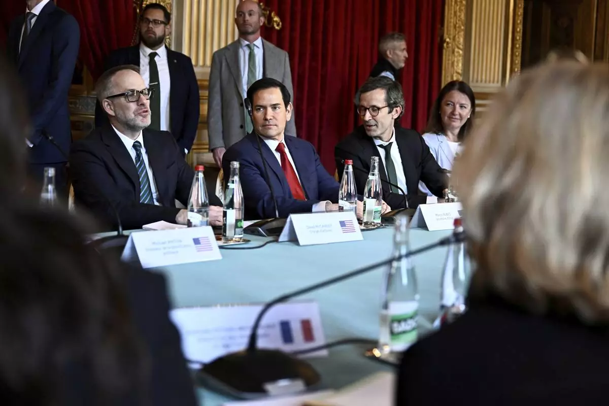 US Secretary of State Marco Rubio, center, and Germany's Political Director of the Ministry of Foreign Affairs Gunter Sautter, right, attend a meeting on Ukraine and its security, in Paris Thursday, April 17, 2025. (Julien de Rosa, Pool via AP)