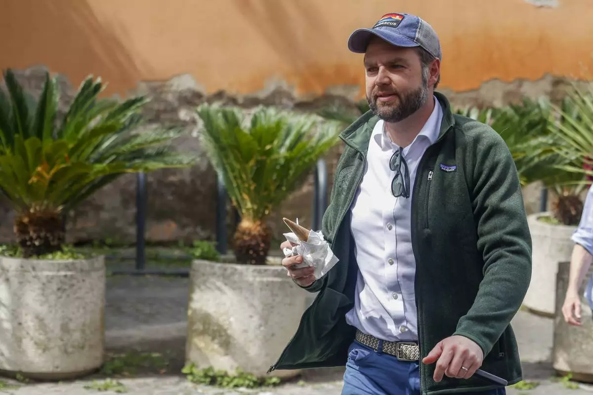 US Vice President J.D. Vance arrives at Rome's Botanic Gardens, Saturday, April 19, 2025. (AP Photo/Riccardo De Luca)
