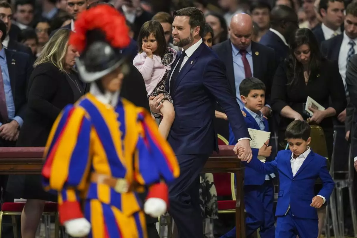 U.S. Vice President JD Vance, with, from left, daughter Mirabel, sons Ewan and Vivek leave at the end of a Good Friday service inside St. Peter's Basilica at the Vatican, Friday, April 18, 2025. (AP Photo/Alessandra Tarantino)