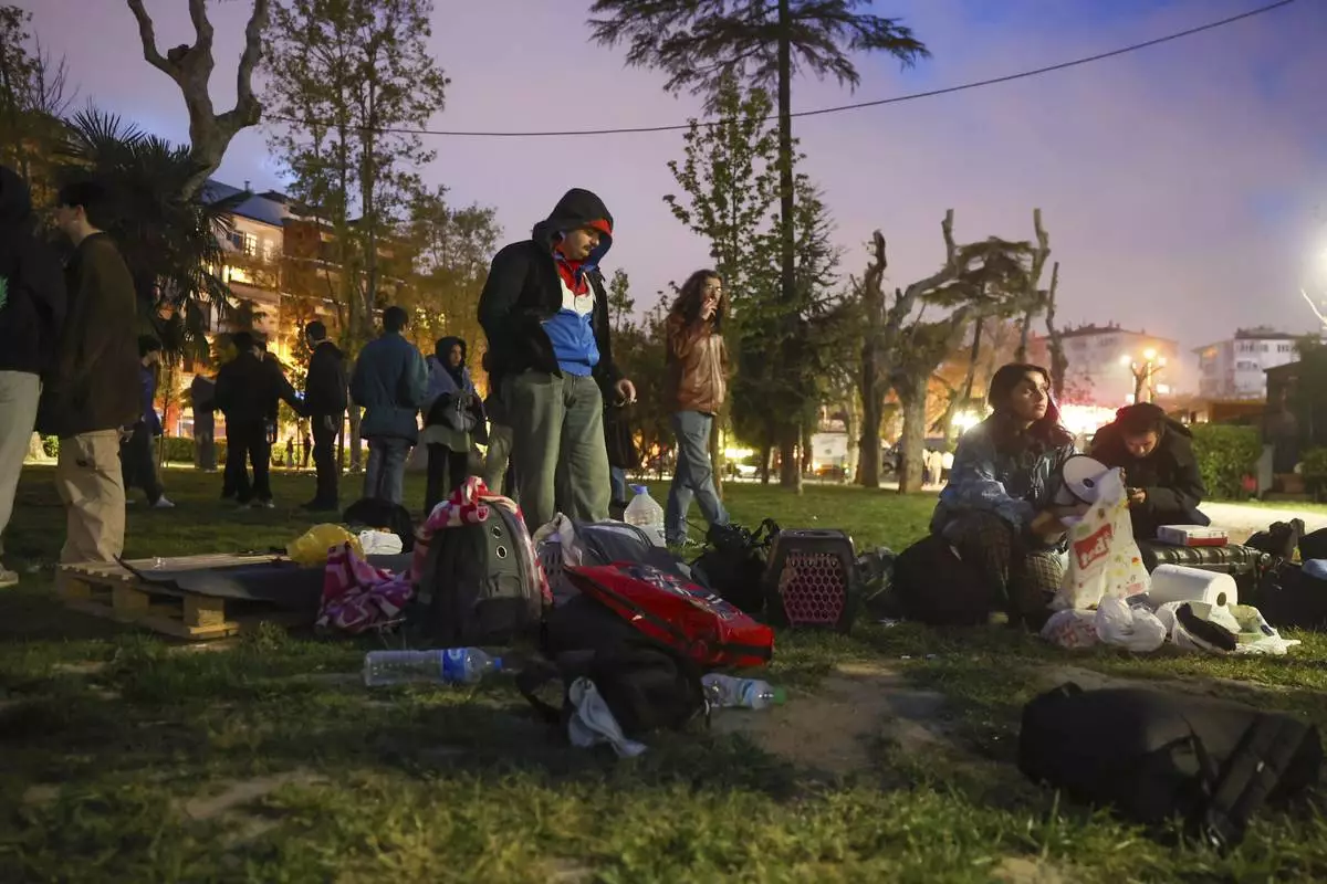 Locals camp in a public park following an earthquake shock with a preliminary magnitude of 6.2, in Istanbul, Turkey, Wednesday, April 23, 2025. (Berkman Ulutin/Dia Photo via AP)