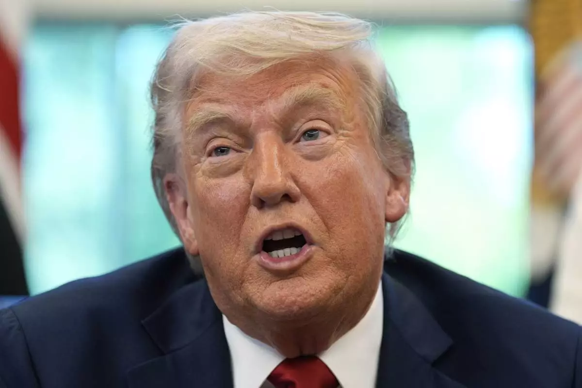 President Donald Trump speaks with reporters after signing executive orders in the Oval Office of the White House, Wednesday, April 23, 2025, in Washington. (AP Photo/Alex Brandon)