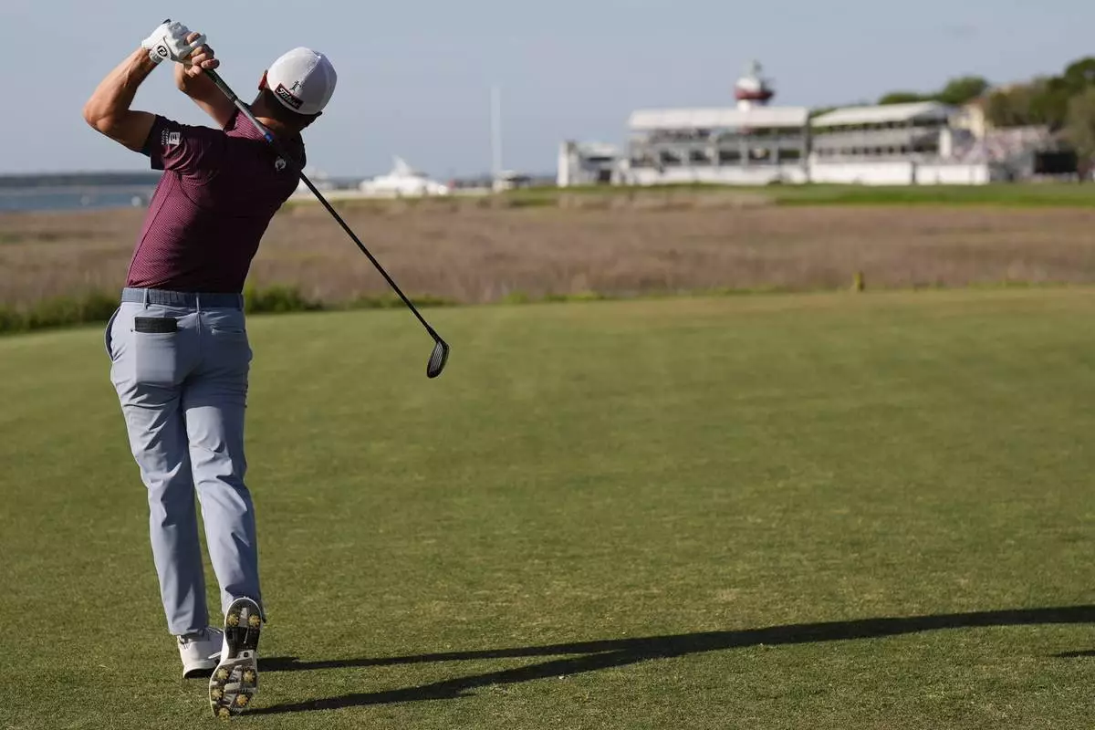 Justin Thomas hits from the 18th green during the third round of the RBC Heritage golf tournament, Saturday, April 19, 2025, in Hilton Head Island, S.C. (AP Photo/Mike Stewart)