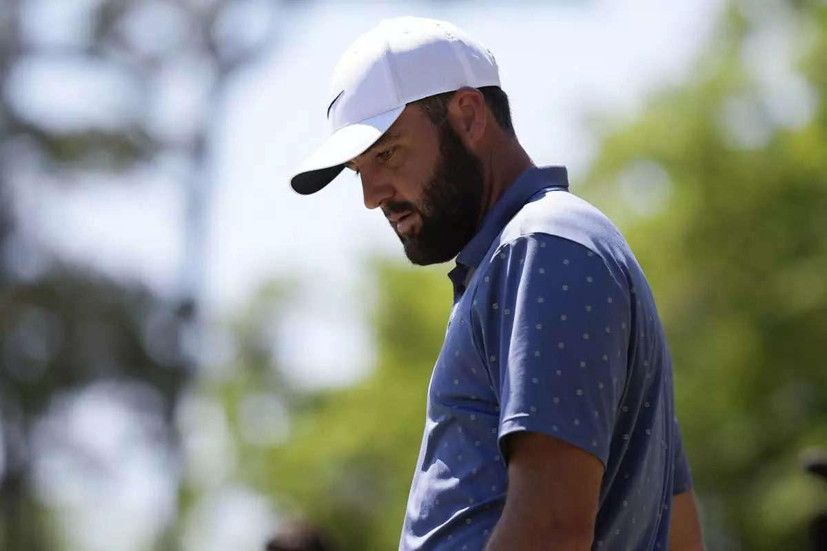 Scottie Scheffler prepares to hit from the seventh tee during the third round of the RBC Heritage golf tournament, Saturday, April 19, 2025, in Hilton Head Island, S.C. (AP Photo/Mike Stewart)