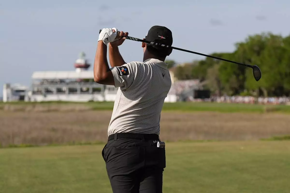 Si Woo Kim hits from the 18th tee during the third round of the RBC Heritage golf tournament, Saturday, April 19, 2025, in Hilton Head Island, S.C. (AP Photo/Mike Stewart)