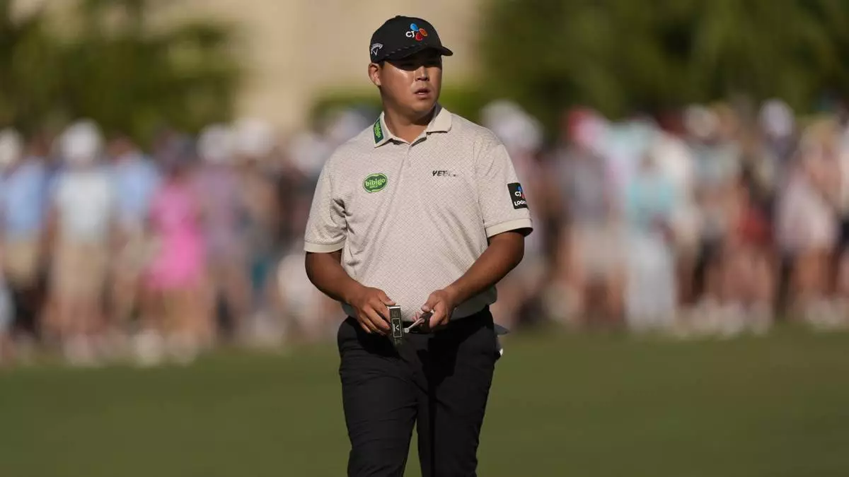 Si Woo Kim walks to the 16th green during the third round of the RBC Heritage golf tournament, Saturday, April 19, 2025, in Hilton Head Island, S.C. (AP Photo/Mike Stewart)