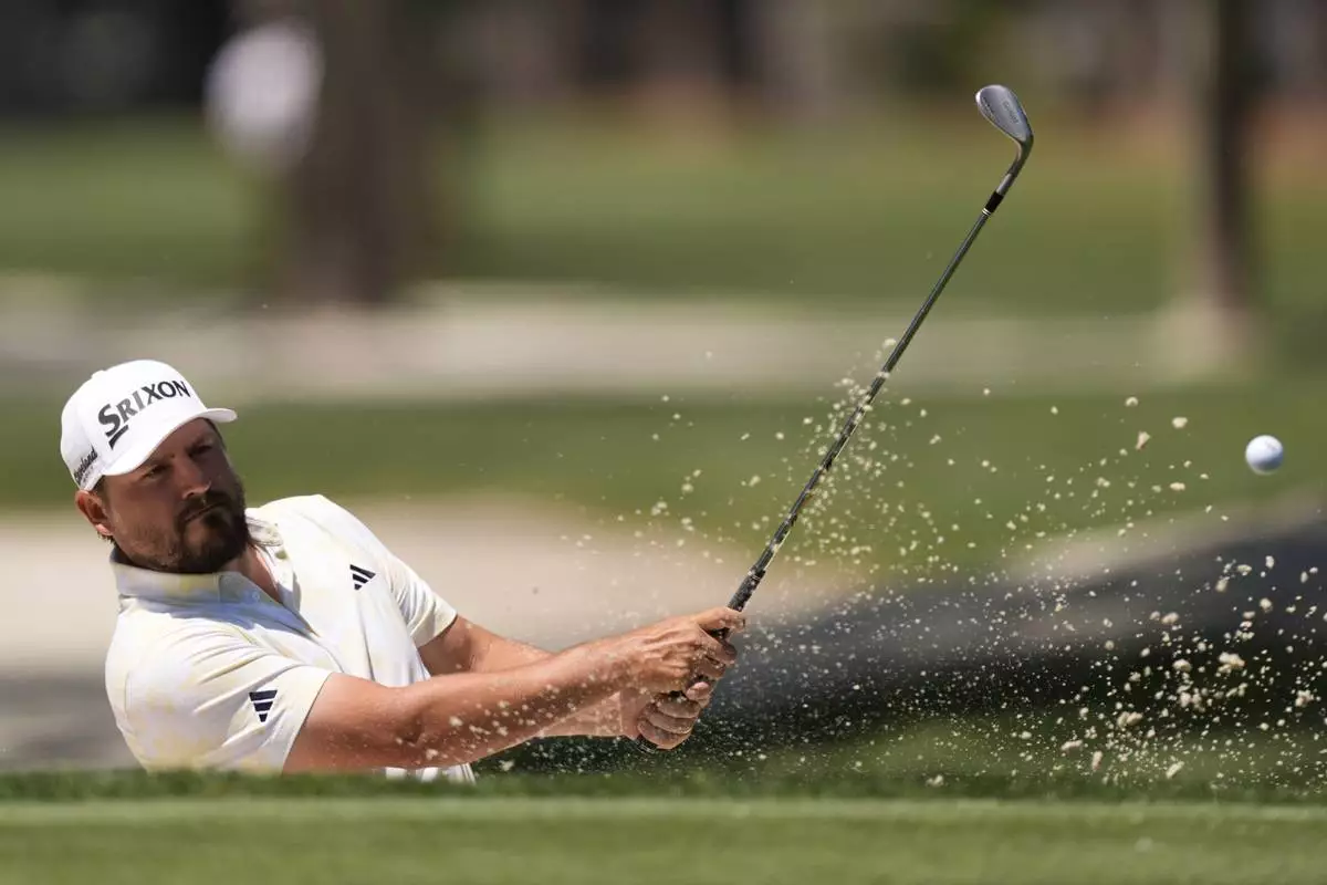 Andrew Novak hits from the second hole during the third round of the RBC Heritage golf tournament, Saturday, April 19, 2025, in Hilton Head Island, S.C. (AP Photo/Mike Stewart)