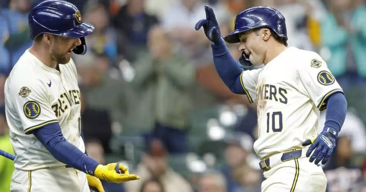 Armed with a torpedo bat, Brewers third baseman Oliver Dunn puts down a run-scoring bunt
